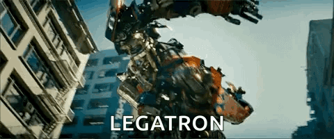 Robot Standing in Front of Legatron Building