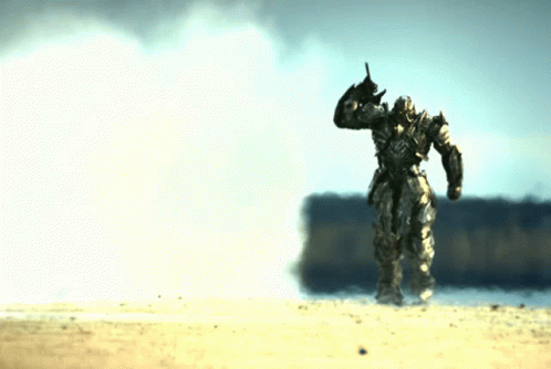 Robot Statue Standing in Sand