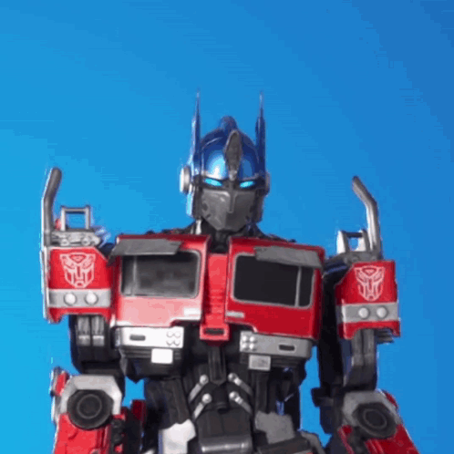 Robot With Blue Helmet and Red Truck on Arms
