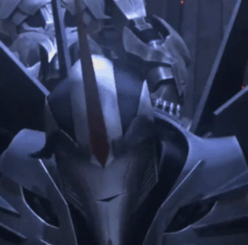 Robot With Red Eyes Looking at Camera