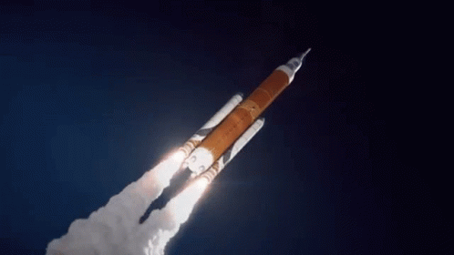 Rocket Flying In Dark Blue Sky GIF