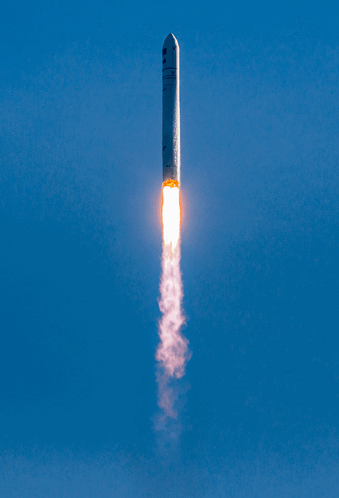 Rocket Flying Through Blue Sky