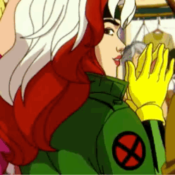 Rogue From The X-Men Is Wearing A Green Jacket With A Red X On It And Yellow Gloves . GIF