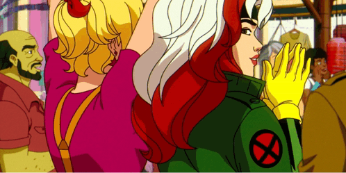 Rogue From The X-Men Stands Next To A Girl GIF