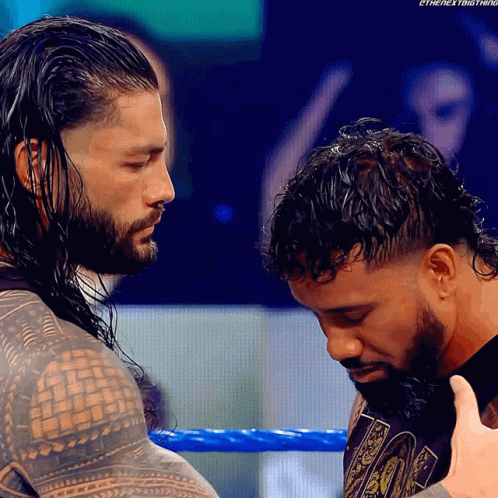 Roman Reigns Holds Jey Uso Head GIF