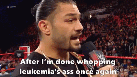 Roman Reigns Is Talking Into A Microphone During A Wrestling Match GIF