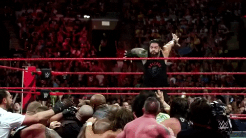 Roman Reigns Out The Ring Dive GIF