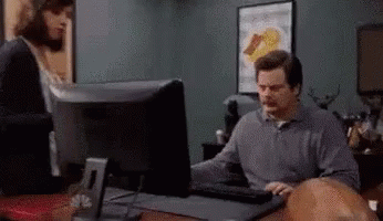 Ron Swanson Computer With Greatest Showman Poster GIF