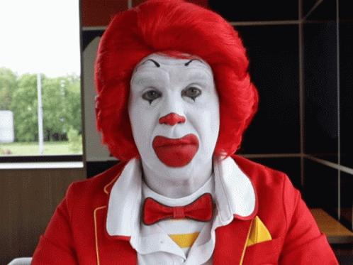 Ronald Mcdonald Covering His Ear GIF
