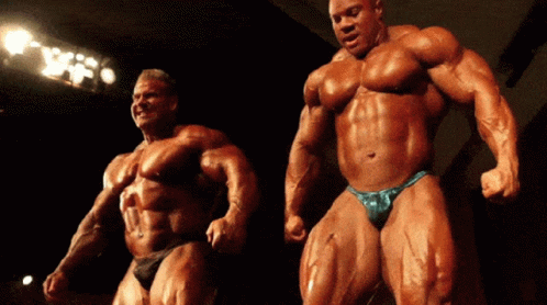 Ronnie Coleman With A Man Competing GIF