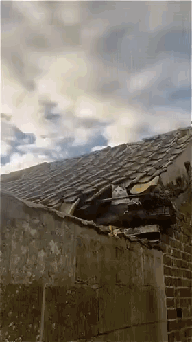 Roof With Hole And Cloudy Sky GIF