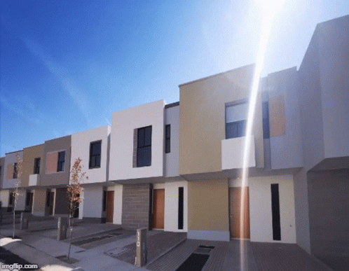 Row of Houses With Sun Shining Through