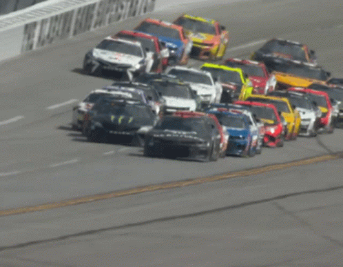 Row Of Race Cars On Track GIF