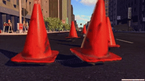 Row of Red Traffic Cones on Street