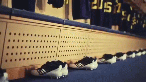 Row of Soccer Cleats Lined Up With 2015 Jerseys