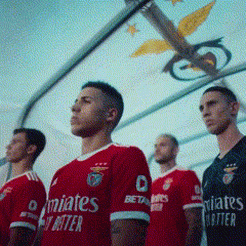 Row of Soccer Players in Red Emirates Jerseys