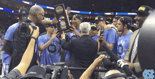 Roy Williams Proudly Raising Their Trophy GIF