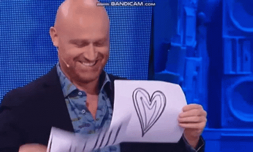 Rudy Zerbi Holding A Heart Drawing GIF