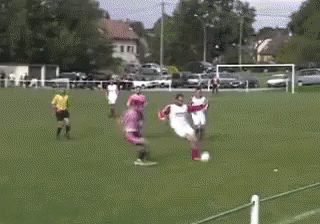 Rugby Player Running While Being Tackled GIF