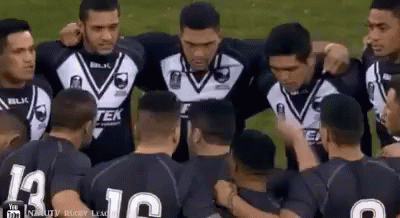 Rugby Players Huddled Together