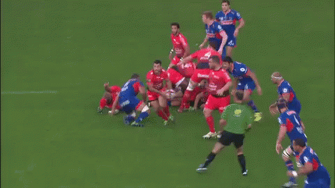 Rugby Players on Field With Number 2