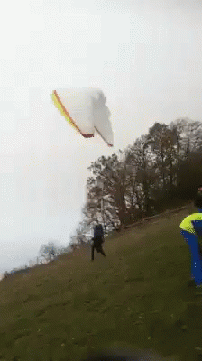 Running Down A Cliff For Paragliding GIF