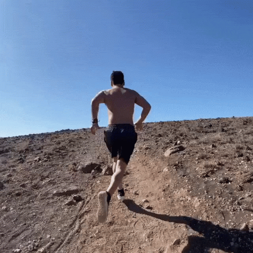 Half Naked Running Man Climbing Uphill GIF