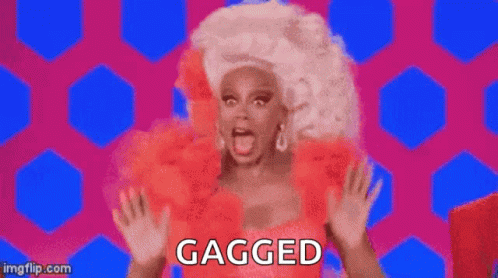 Rupaul In Red Dress And White Wig Saying Gagged GIF