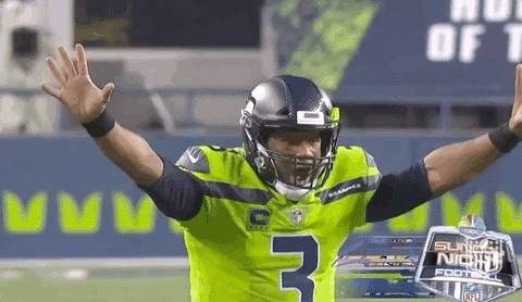 Russell Wilson In Yellow Jersey GIF