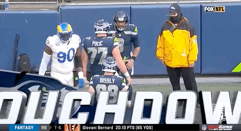 Russell Wilson Tapping Helmet GIF