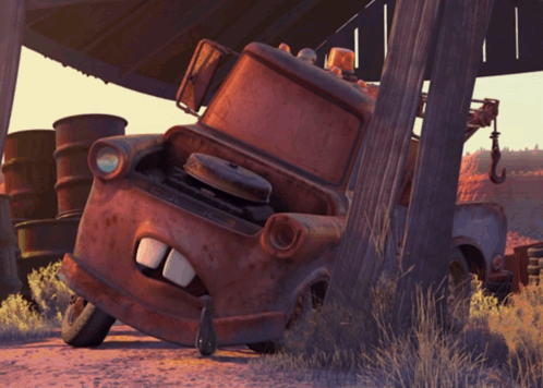 Rusty Tow Truck Leaning Against Wooden Post