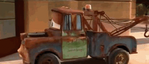 Rusty Tow Truck Parked On Side Of Road GIF