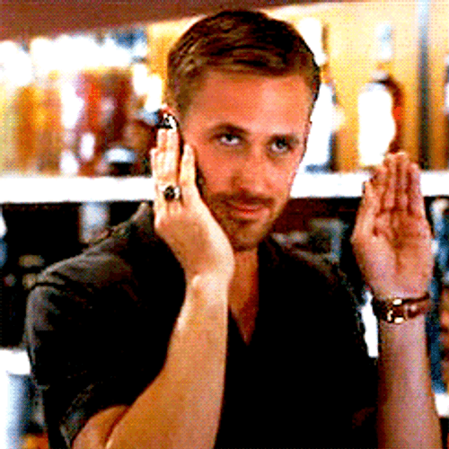 Ryan Gosling Waving While On The Phone GIF