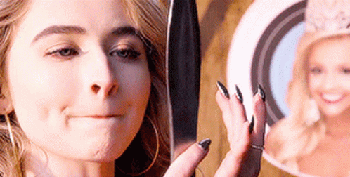 Sabrina Carpenter Looking At A Mirror GIF