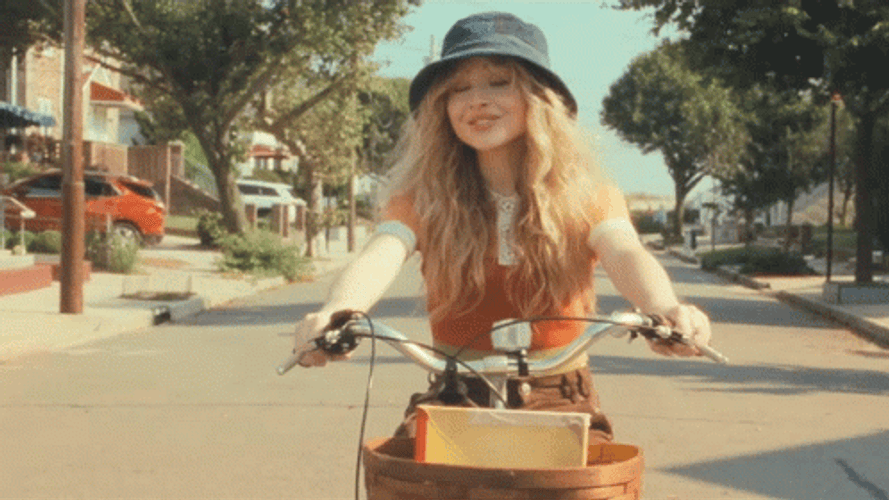 Sabrina Carpenter Riding A Bicycle GIF | GIFDB.com