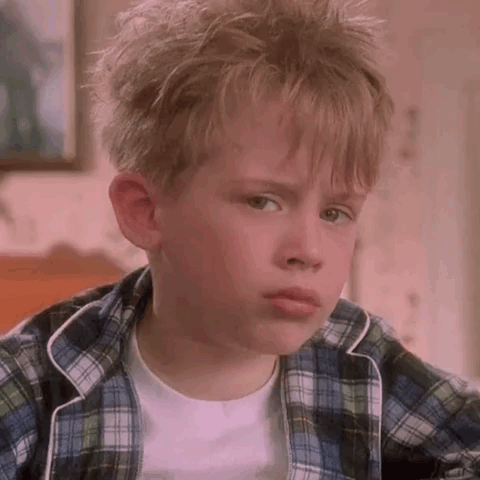 Sad Boy in Plaid and White Shirt