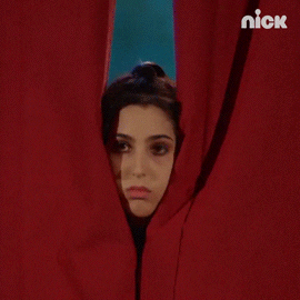 Sad Girl Sneaking Behind Curtains GIF