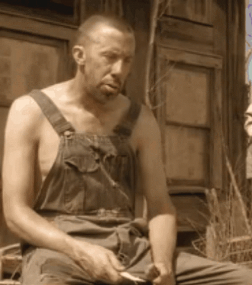Sad Hillbilly Sharpening A Knife GIF