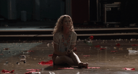Sad Kate Hudson Holding A Rose GIF