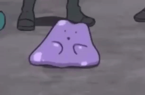 Sad Purple Cartoon Character Lying on Ground