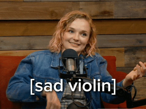 Sad Woman Performing Worlds Smallest Violin GIF