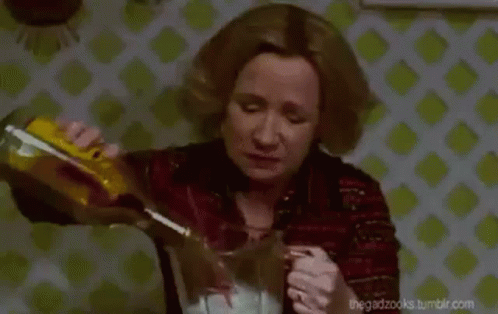 Sad Woman Pouring Alcohol GIF