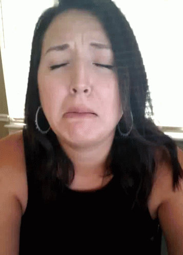 Sad Woman With Hoop Earrings GIF