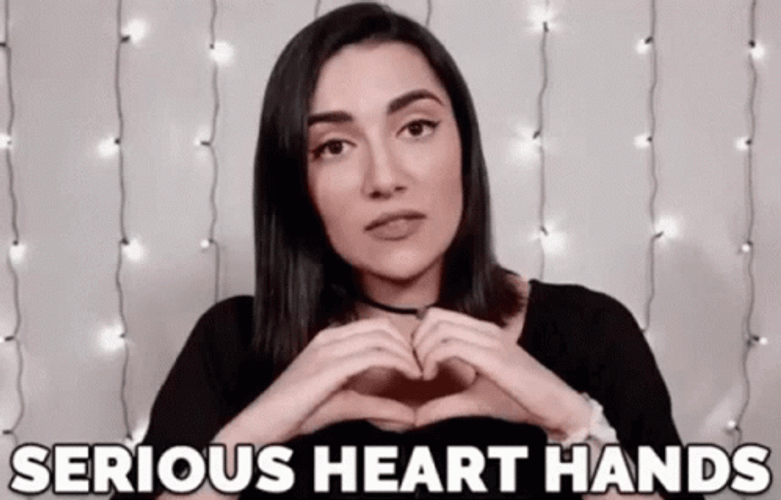 Safia Nygaard Serious Heart Hands GIF