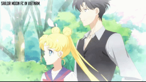 Sailor Moon Fc In Vietnam Shows A Man And A Girl Standing Next To Each Other GIF