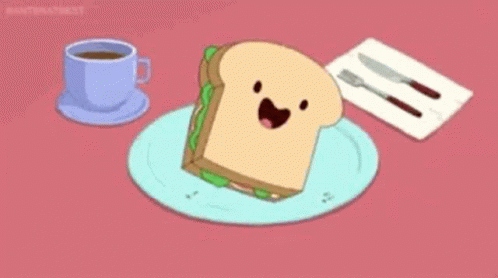 Sandwich With Face Next to Coffee and Knife Fork