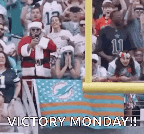 Santa Claus Taking Photo of Football Crowd