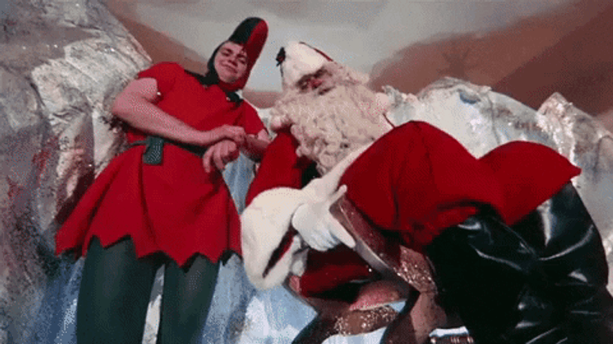 Santa Kicking Boy On Slide GIF