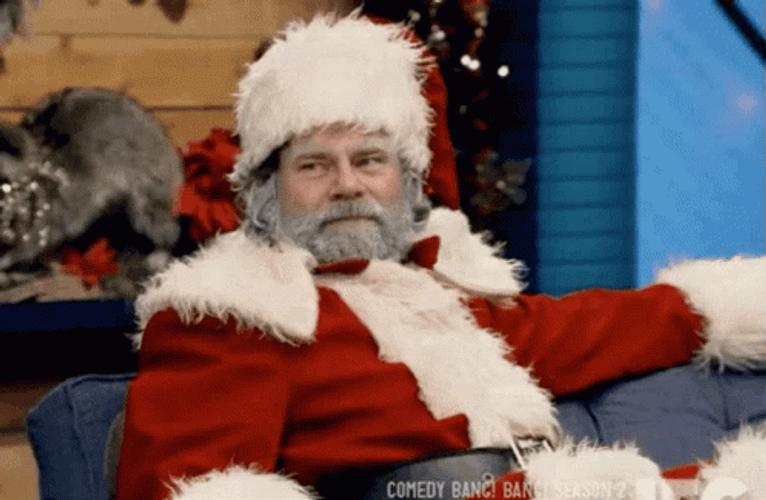 Santa Smiling And Being Serious GIF
