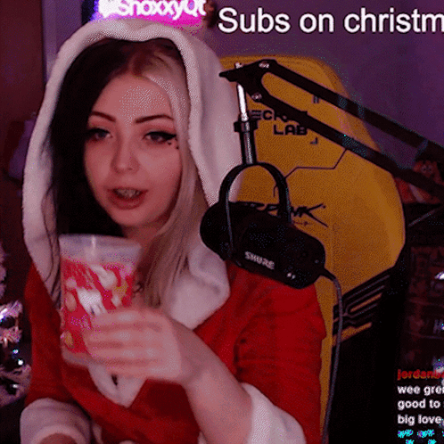 Santa Woman with Cup, Mic, Subs on Christm